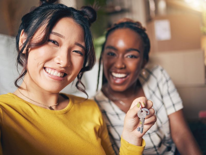 couple_of_friends_keys_and_new_home_selfie_for_mo_2023_11_27_05-min