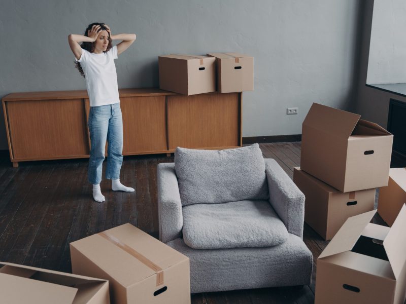 upset_woman_homeowner_gets_stressed_by_relocation_2023_11_27_04-min